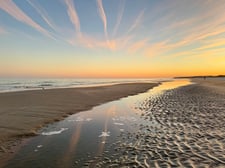 Beach with colorful sky